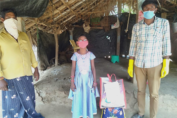 Family of deafblind child receiving ration kit