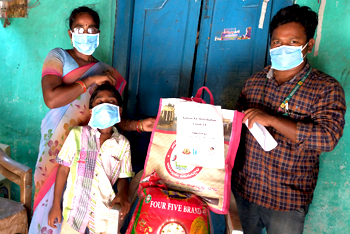 Family of deafblind child receiving ration kit