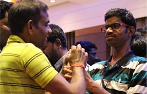 Adults with deafblindness from Udaan - Network of Adults with deafblindness communicating with eachother in tactile sign language during National Conclave